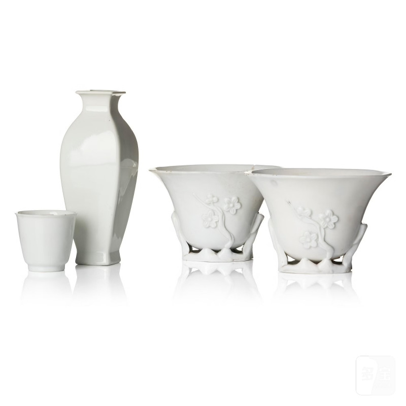 A blanc de chine vase and three cups,
